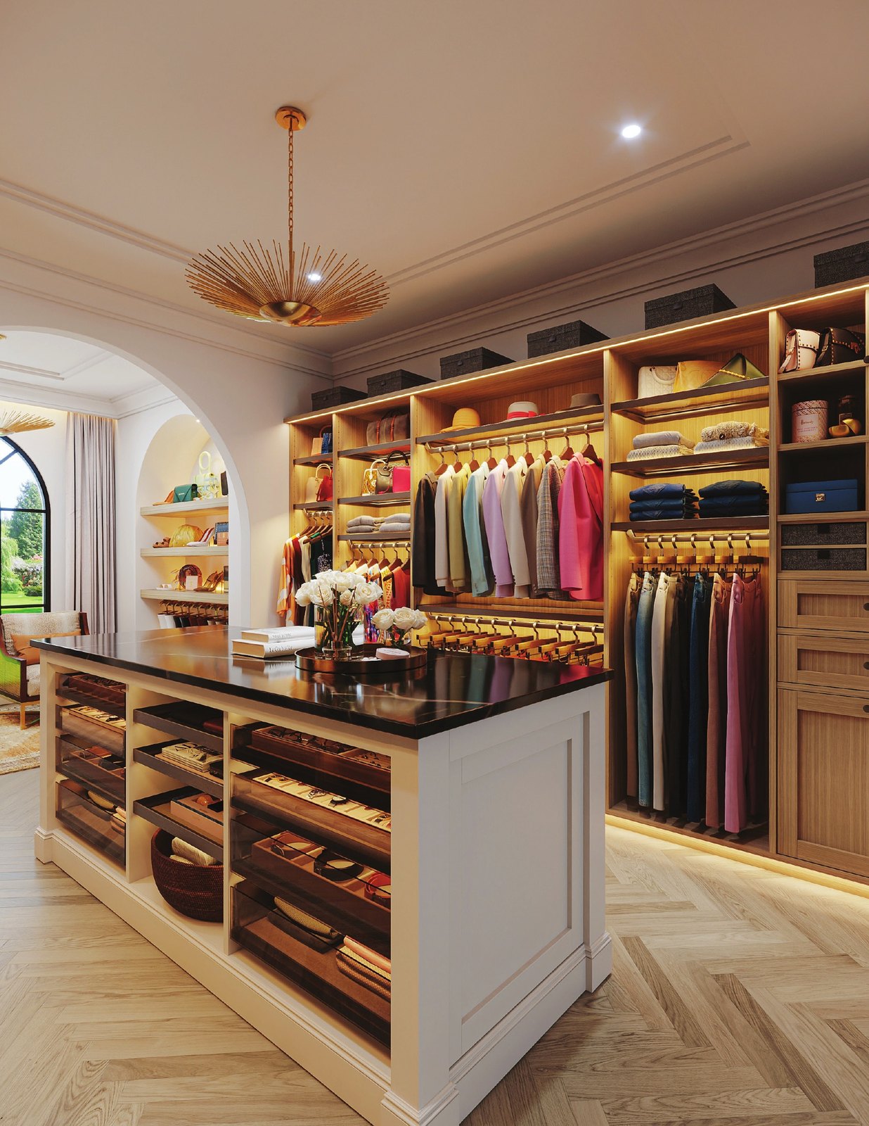 Walk-in closet with oak shelving, LED lighting and a white island with a black top